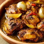 Close-up of Black Pepper Chicken with creamy sauce and pepper garnish